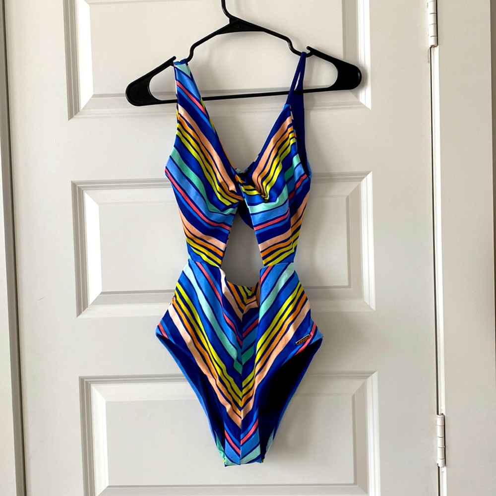 Asymmetrical one piece with cut outs, brand new with tags